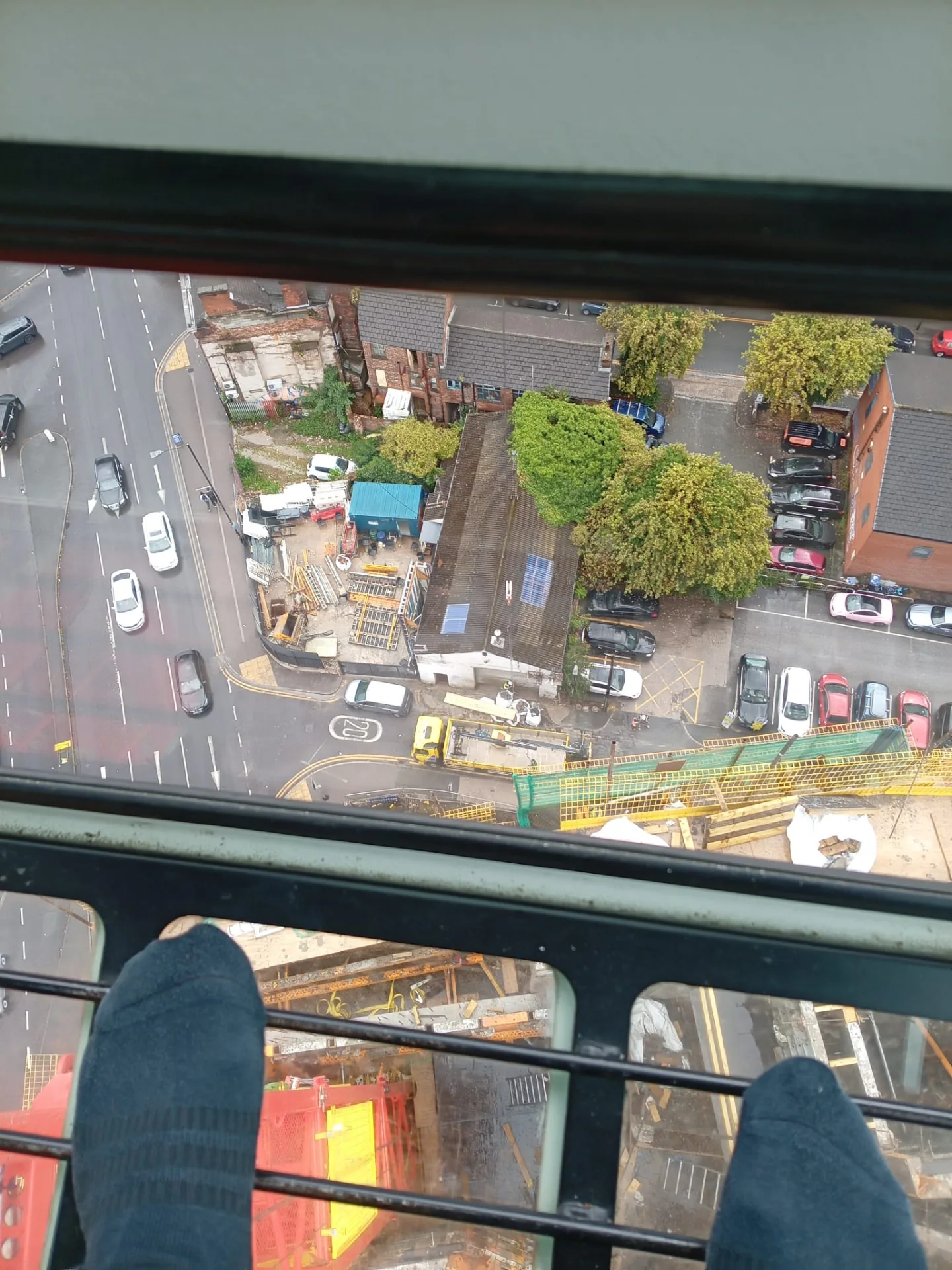 View straight down to the street from a tower crane cab